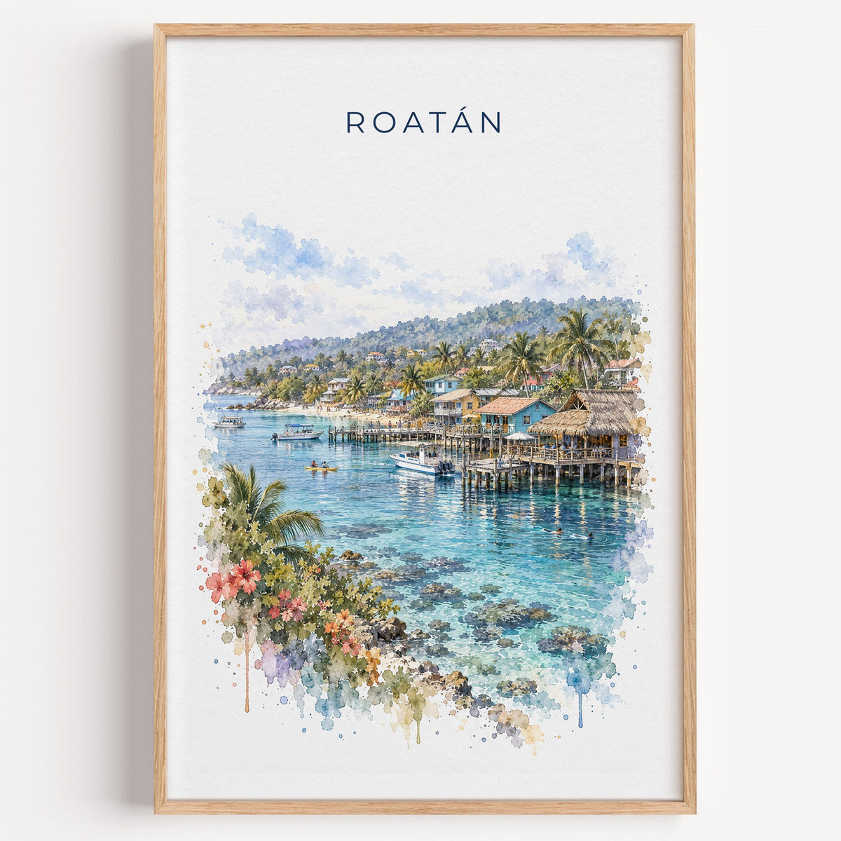 Roatan watercolor print in a light oak frame on a plain white wall