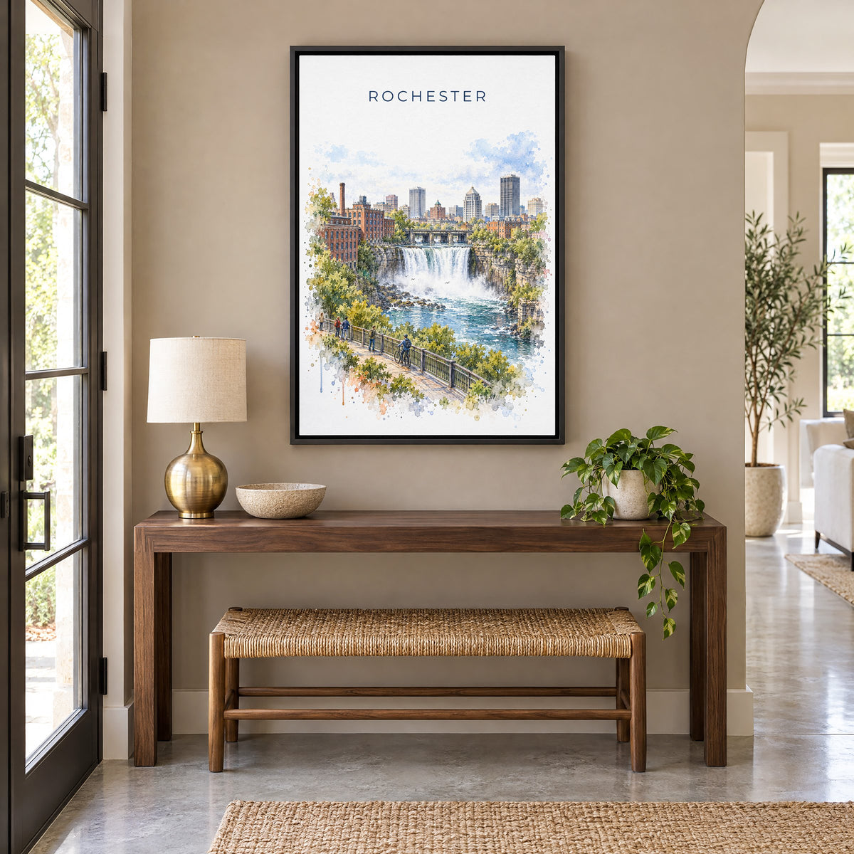 Rochester, New York watercolor print as a black floater canvas above a walnut console and woven bench in an entryway