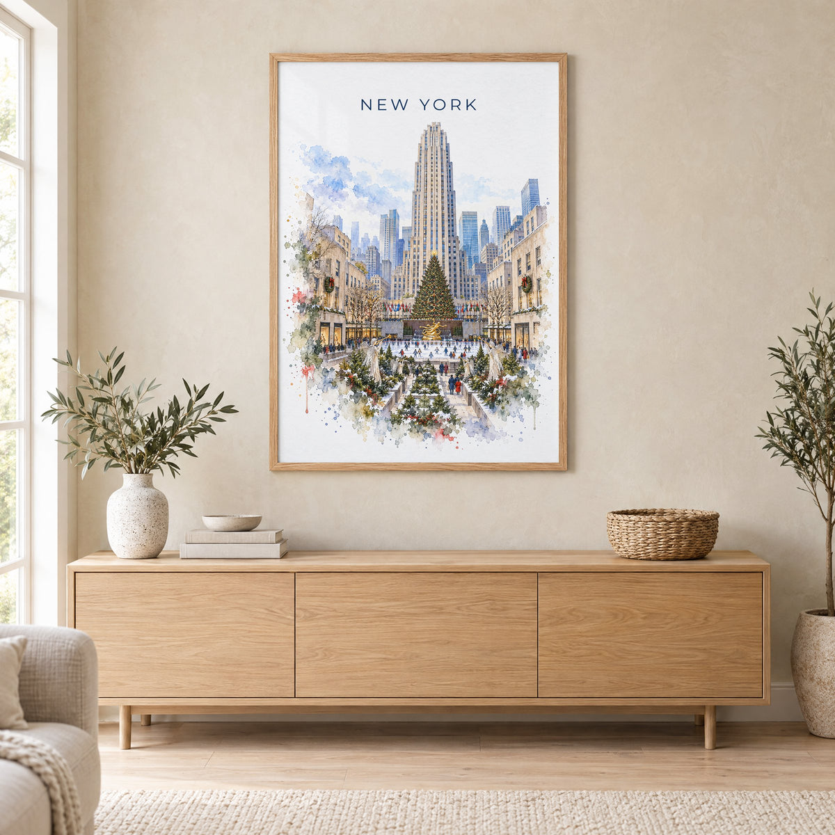 Rockefeller Center watercolor print in an oak frame above a light wood sideboard in a Scandinavian living room