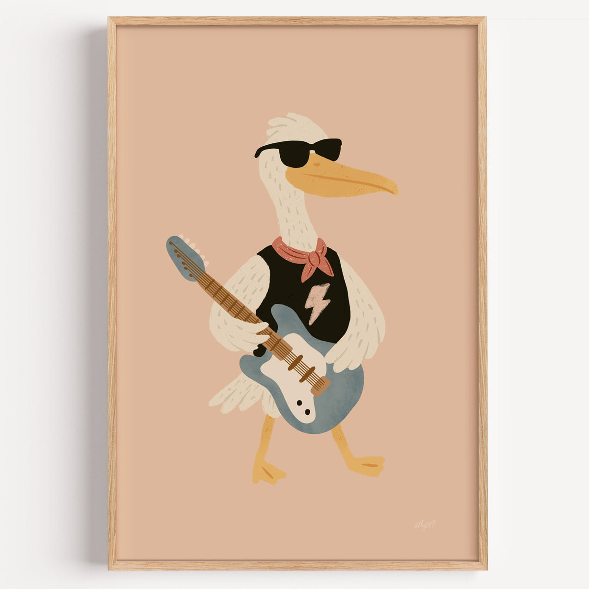 Pelican playing electric guitar nursery print in a light oak frame on a plain white wall