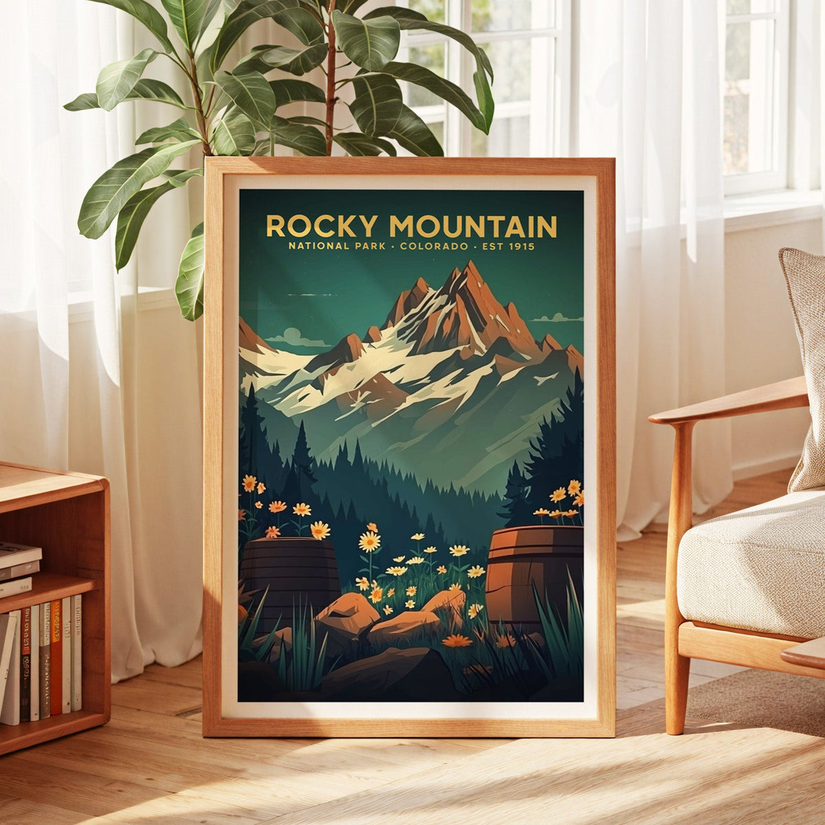 Rocky Mountain National Park print in an oak frame by a sunlit window with sheer curtains and a fig plant