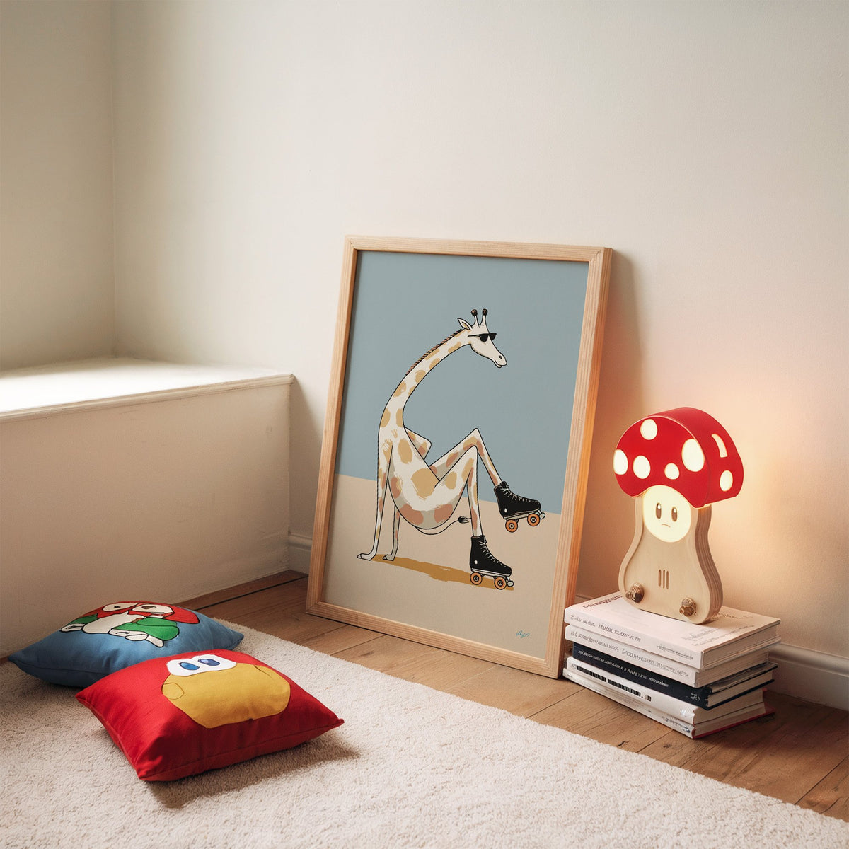 Giraffe wearing roller skates nursery print in an oak frame leaning on a rug beside a mushroom lamp and floor cushions