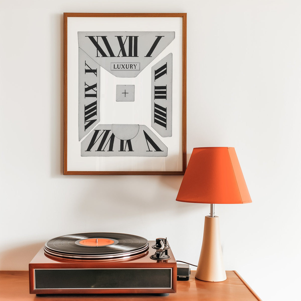 Broken Roman numeral clock dial graphic print in a walnut frame above a record player and orange lamp
