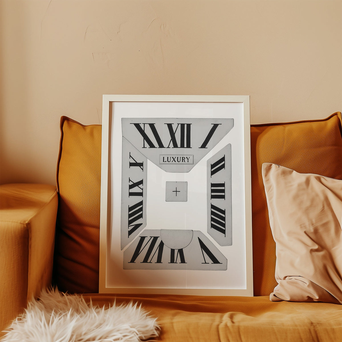 Broken Roman numeral clock dial graphic print in a white frame leaning on a mustard velvet sofa