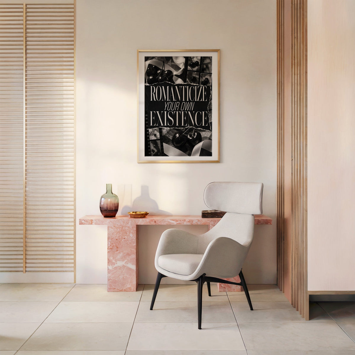 Romanticize your own existence cherry collage print shown in a gold frame above a pink marble console and armchair
