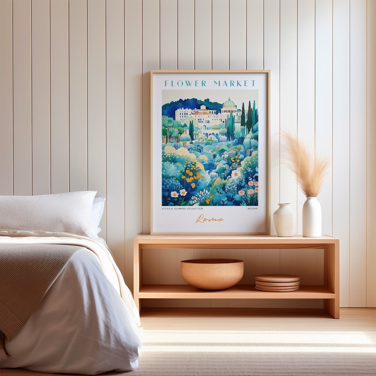 Rome flower market print in an oak frame on a wood bench against a white shiplap bedroom wall with pampas grass