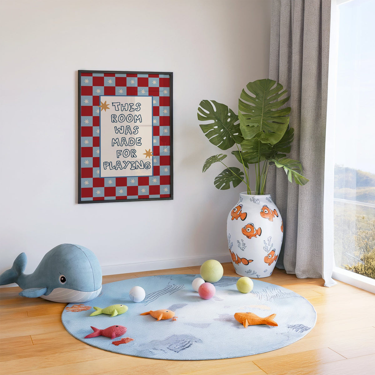 Room made for playing checkered nursery print in a black frame in a playroom with an ocean rug and whale plush
