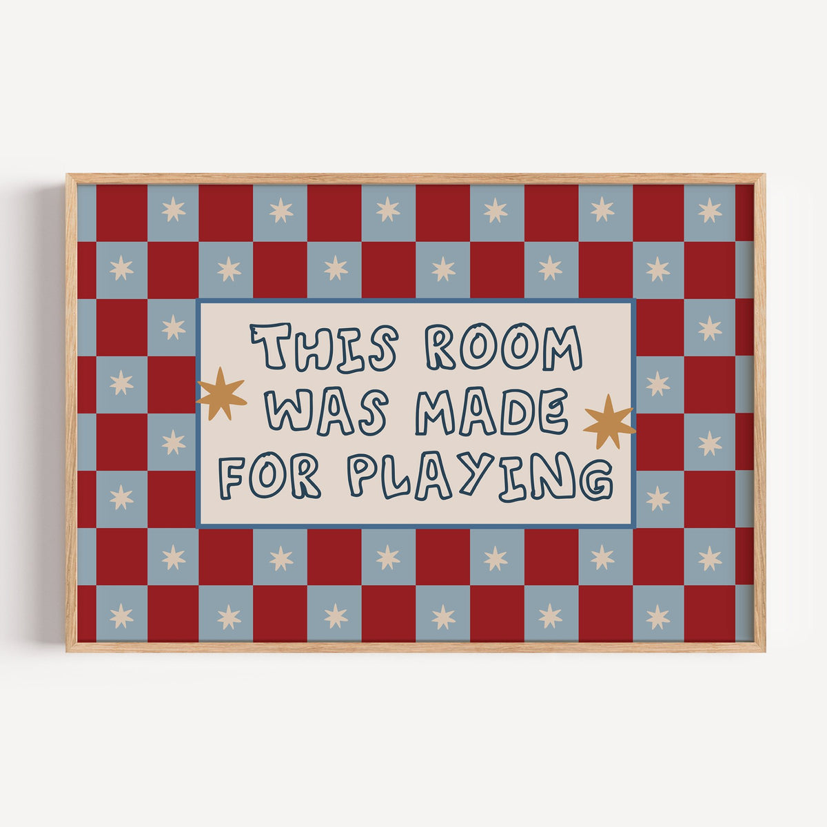 Landscape room made for playing checkered nursery print in a light oak frame on a plain white wall