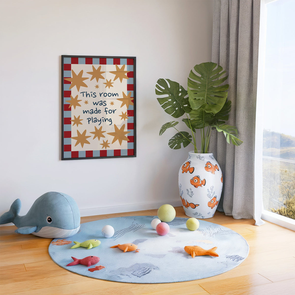 Room made for playing stars nursery print in a black frame in a playroom with an ocean rug and whale plush