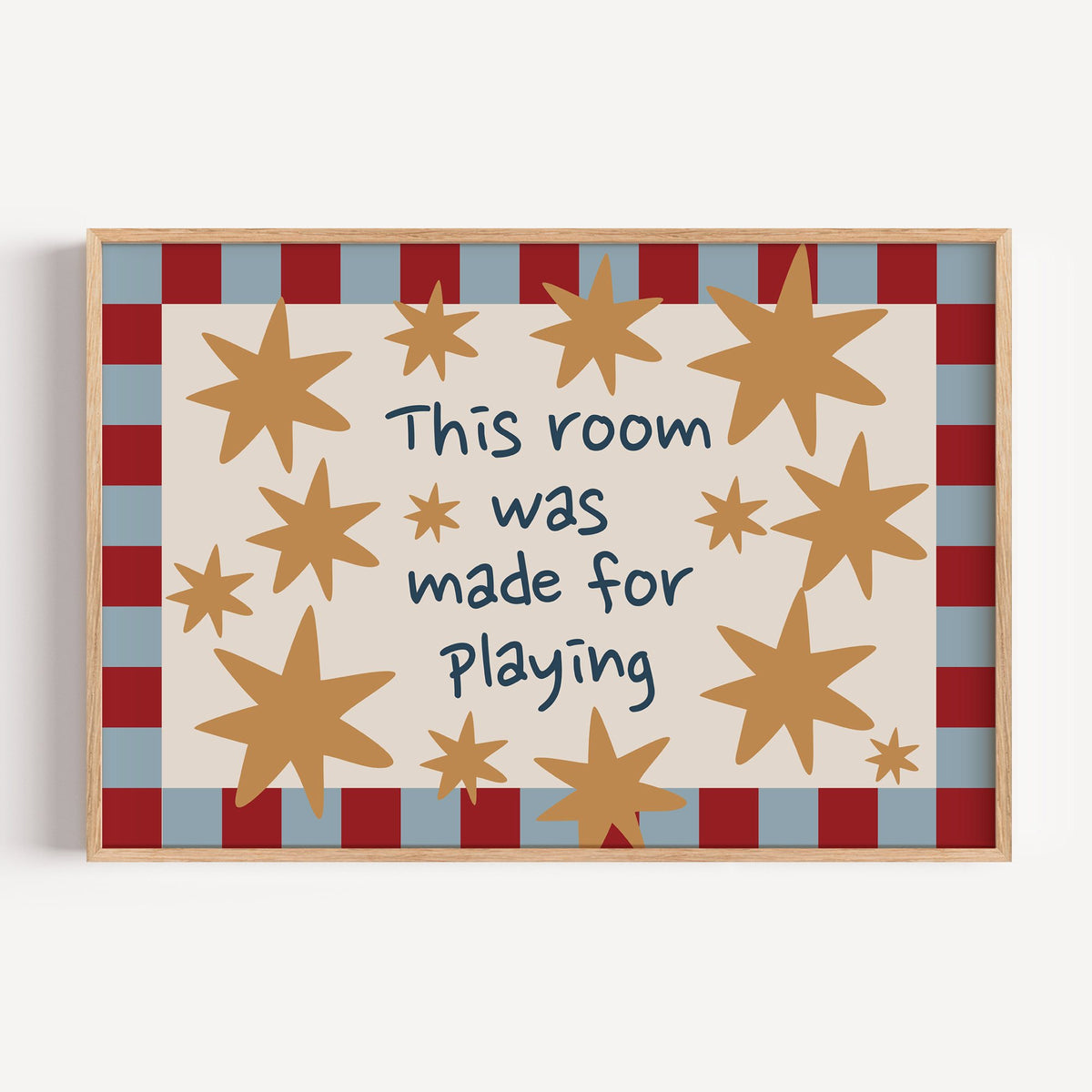 Landscape room made for playing stars nursery print in a light oak frame on a plain white wall