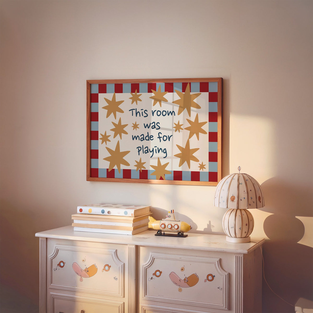 Landscape room made for playing stars nursery print in a cherry wood frame above a painted dresser and lamp