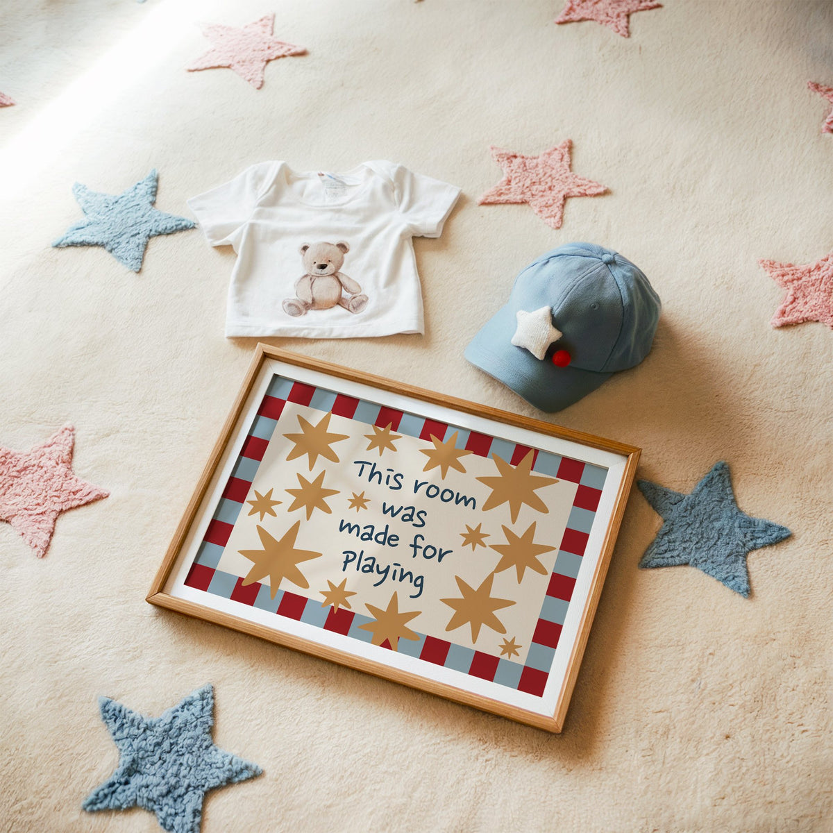 Landscape room made for playing stars nursery print in a matted oak frame on a star rug with a baby tee