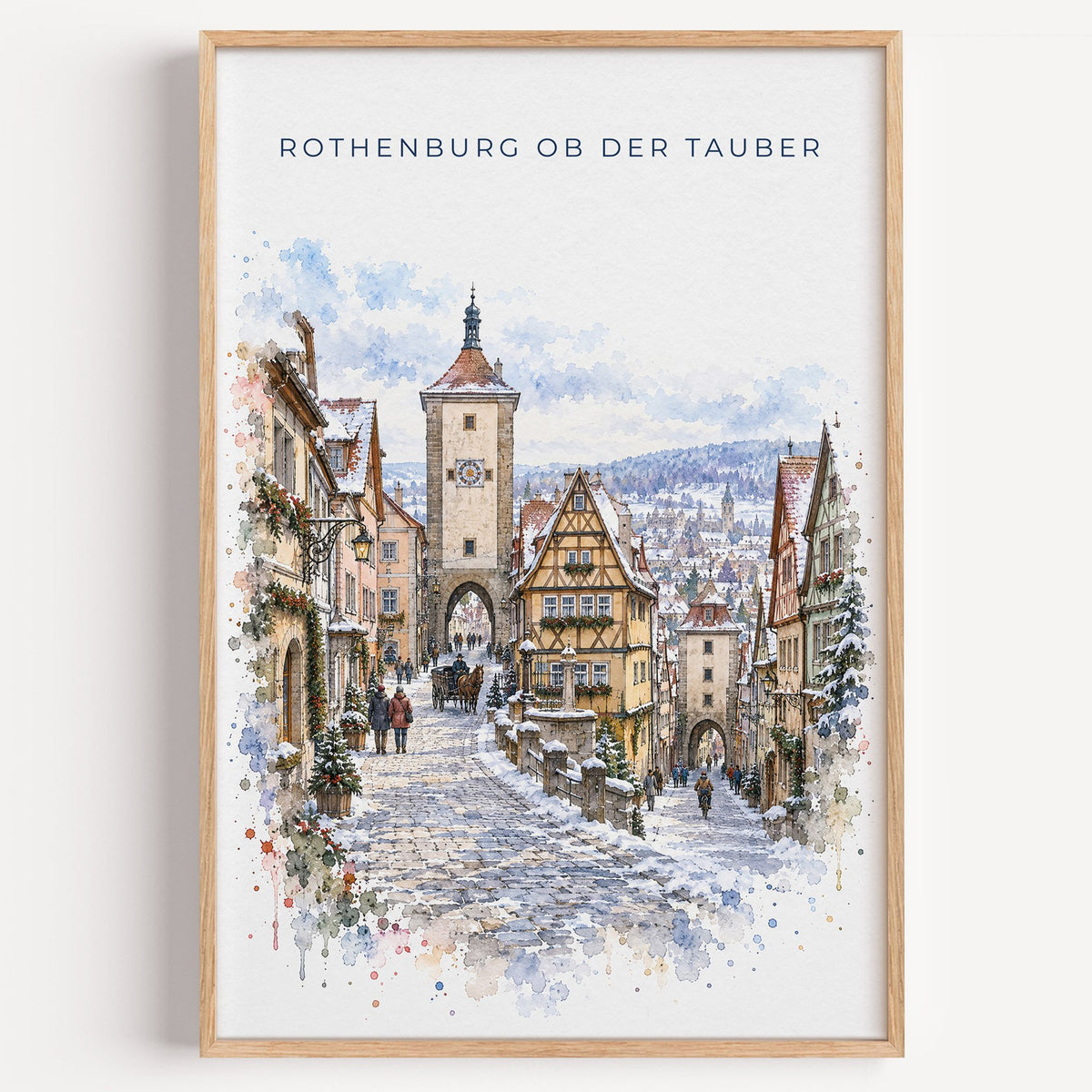 Rothenburg ob der Tauber watercolor print in a light oak frame on a plain white wall