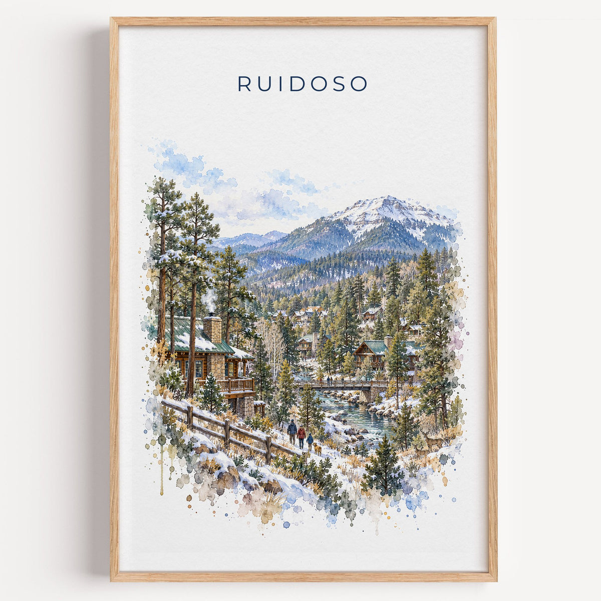 Ruidoso, New Mexico watercolor print in a light oak frame on a plain white wall