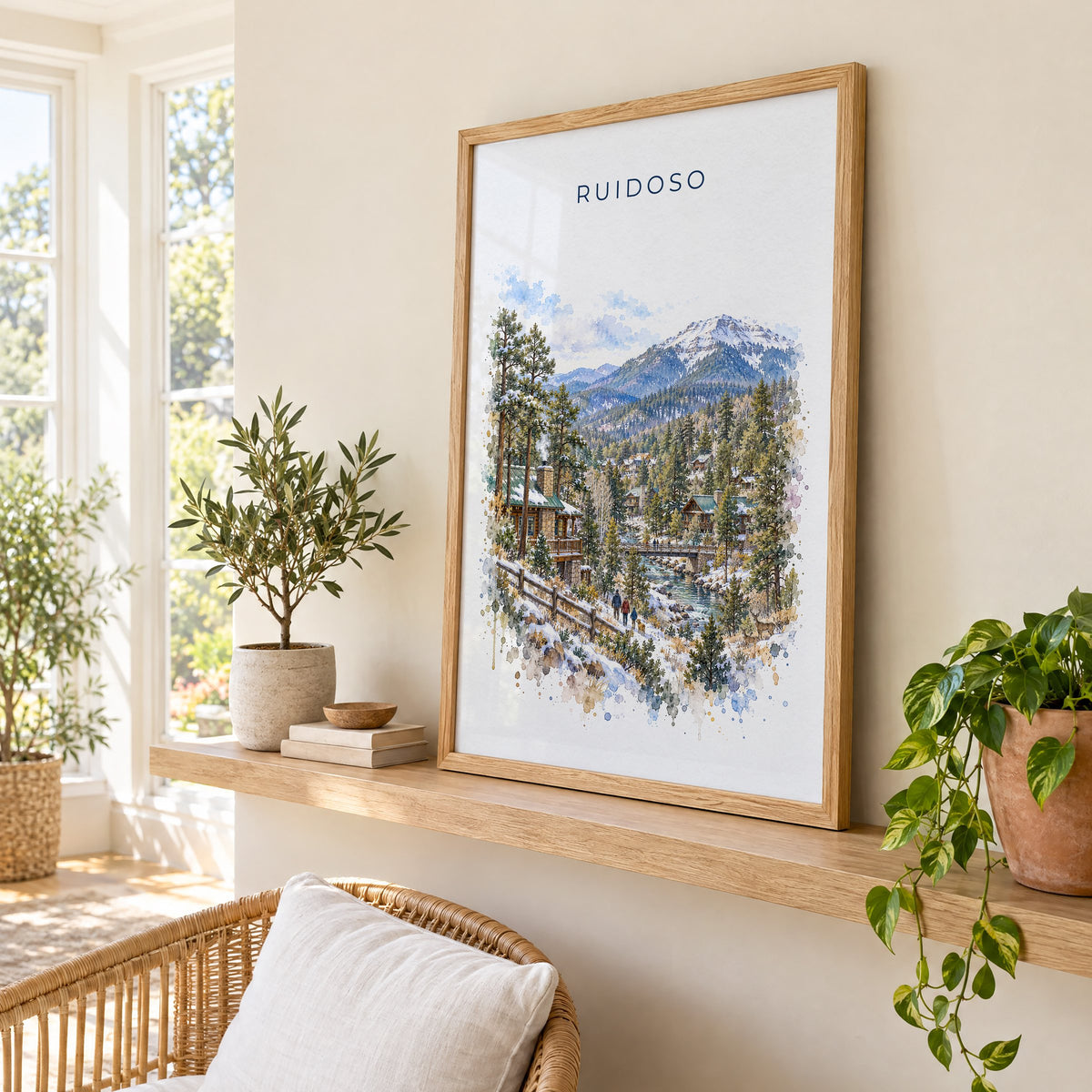 Ruidoso, New Mexico watercolor print in an oak frame on a picture ledge in a sunlit sunroom