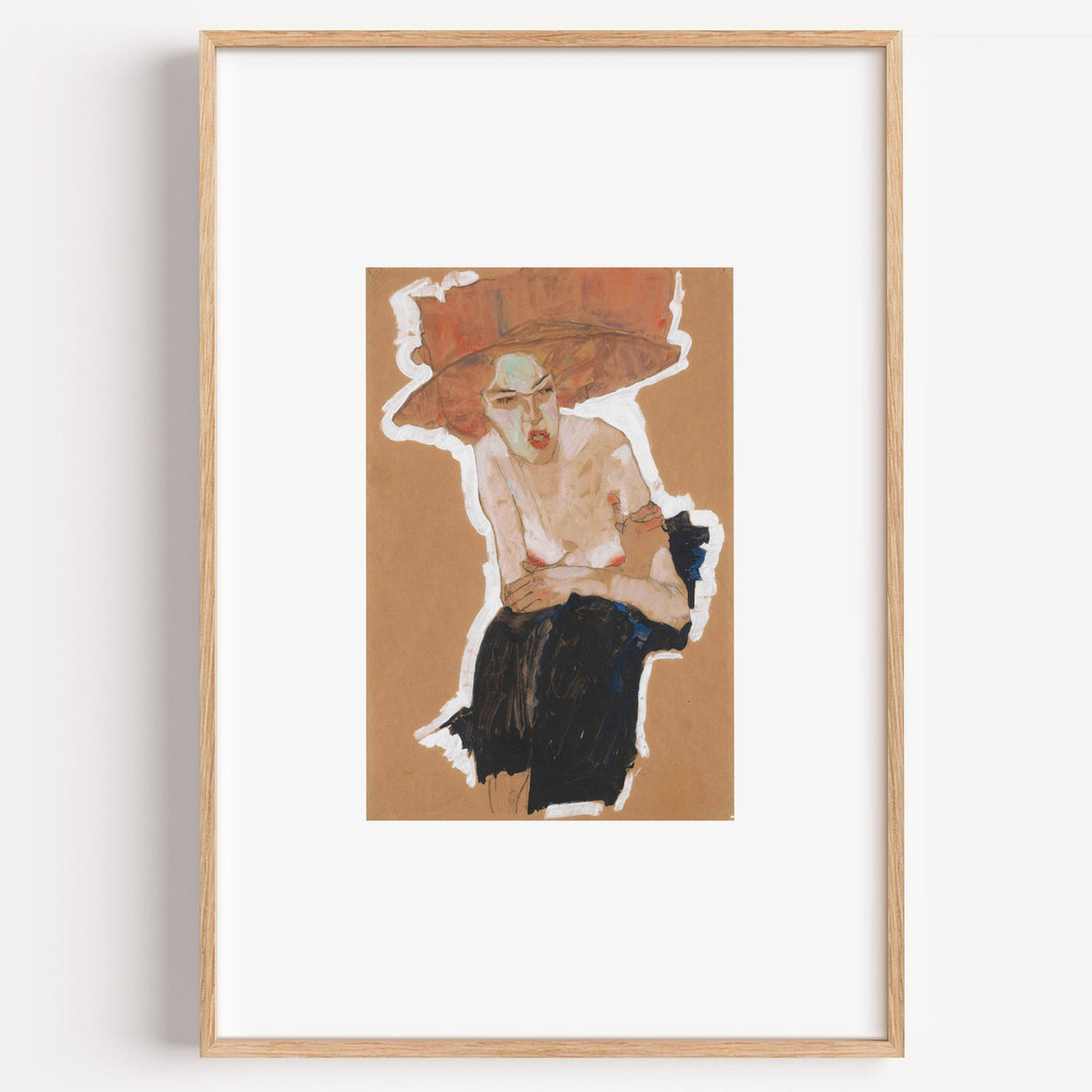 Rust hat woman gouache on kraft paper print in a light oak frame on a plain white wall