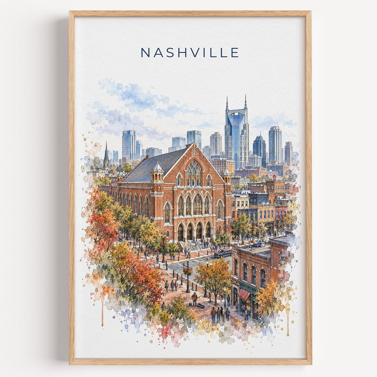 Ryman Auditorium watercolor print in a light oak frame on a plain white wall