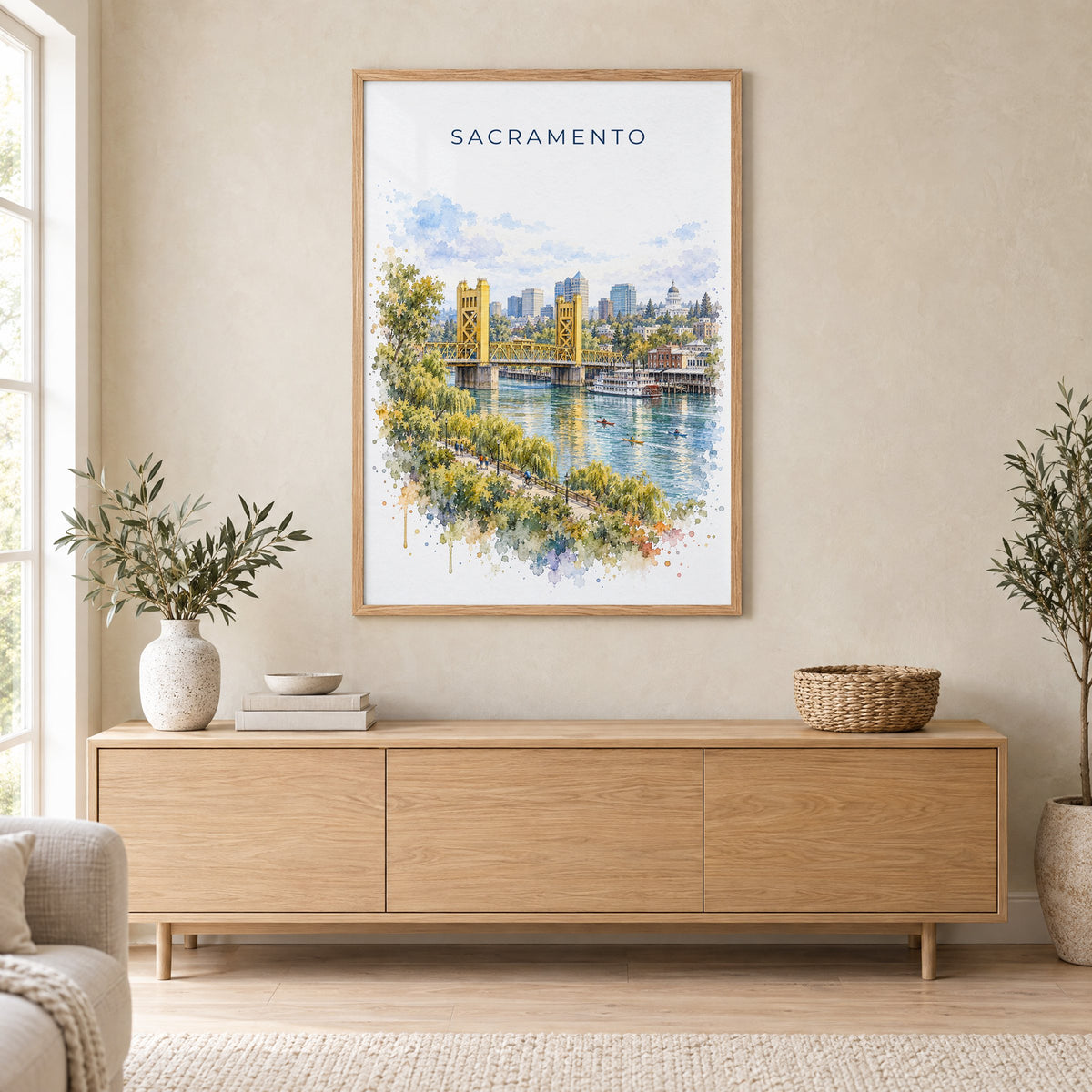 Sacramento watercolor print in an oak frame above a light wood sideboard in a Scandinavian living room