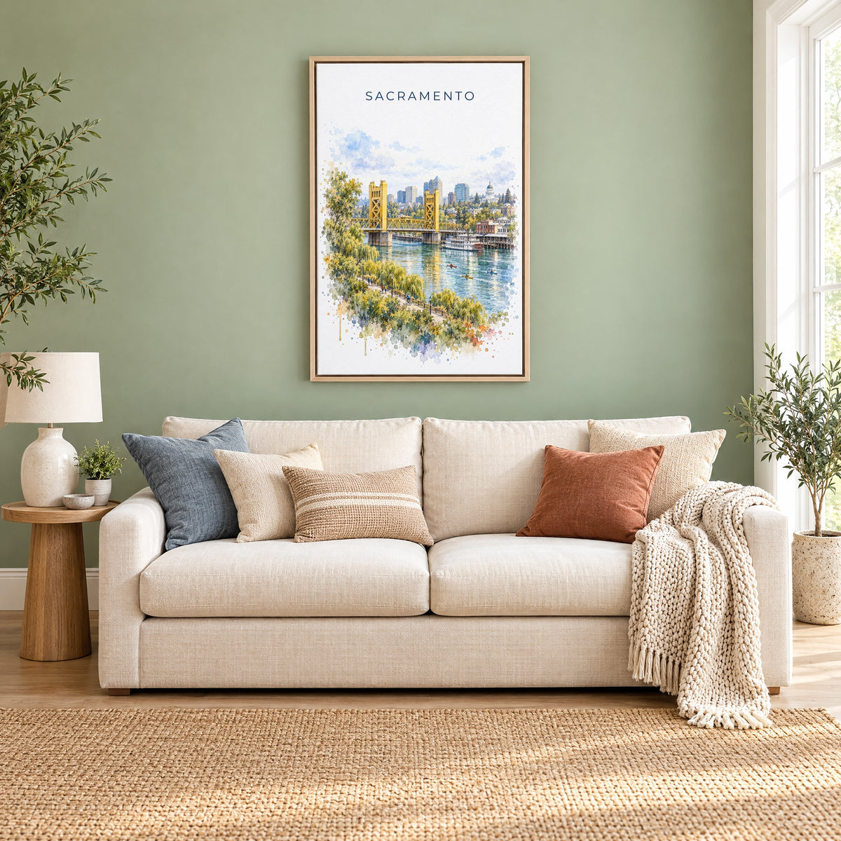 Sacramento watercolor print as a natural floater canvas above a cream linen sofa on a sage green wall