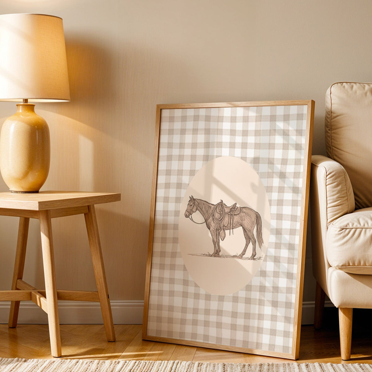 Saddled horse print in an oak frame beside an amber ceramic lamp