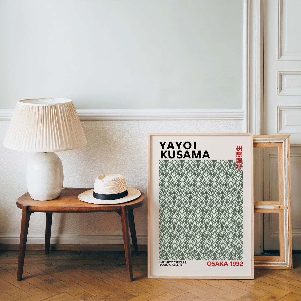 Yayoi Kusama inspired sage green circle pattern print beside a bench and straw hat