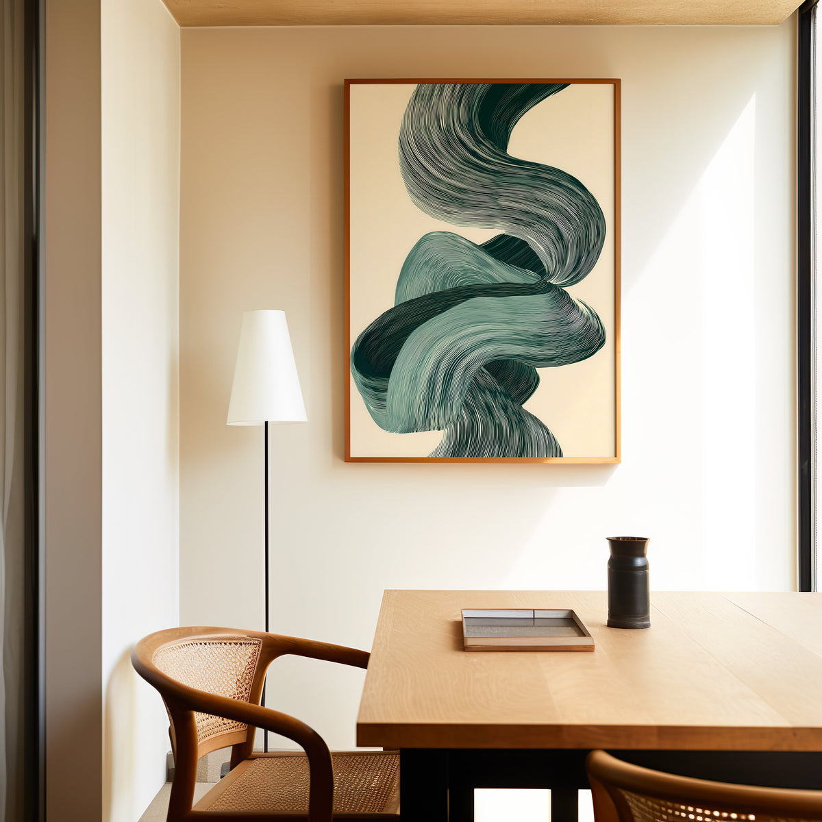 Sage green line ribbon swirl abstract print in a slim oak frame above a dining table with a cane-back chair