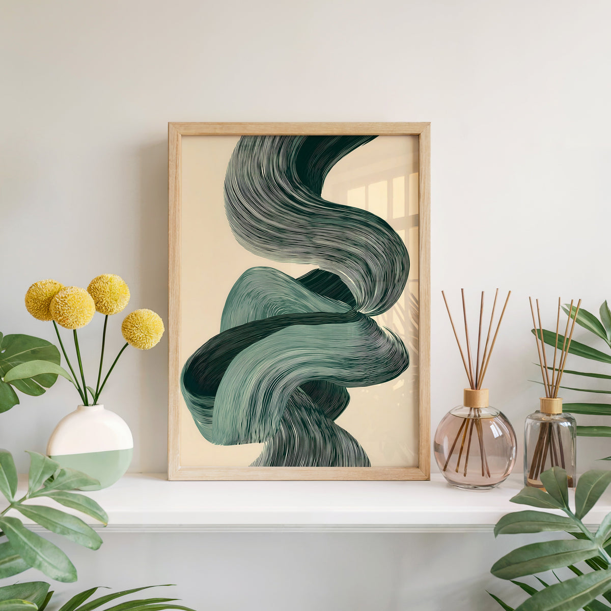 Sage green line ribbon swirl abstract print in a light oak frame leaning on a white mantel with yellow flowers