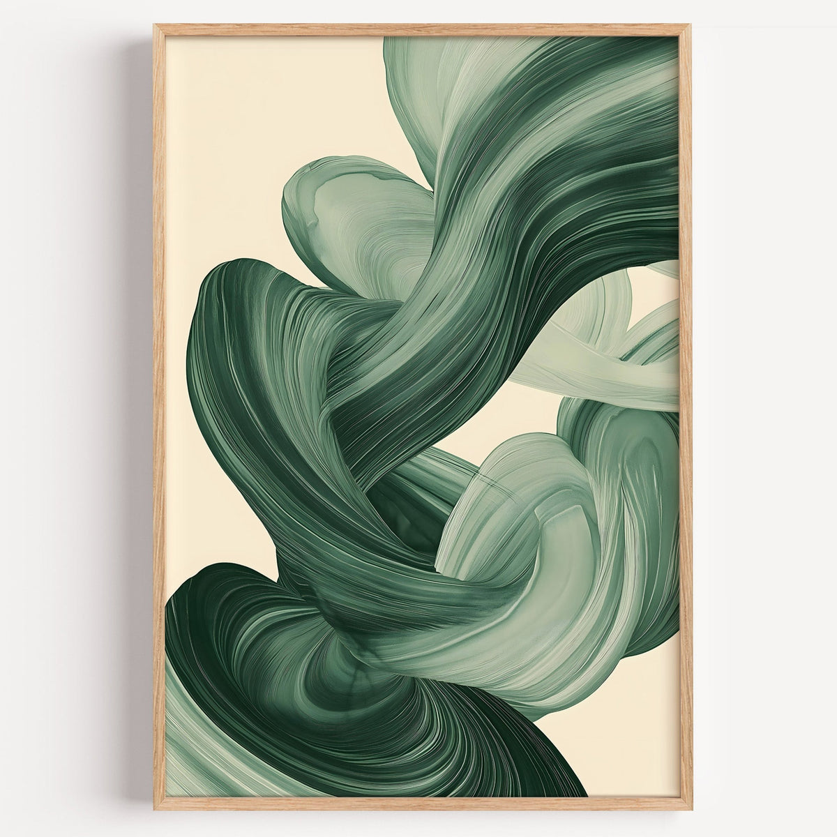 Sage green paint swirl abstract print in a light oak frame on a plain white wall