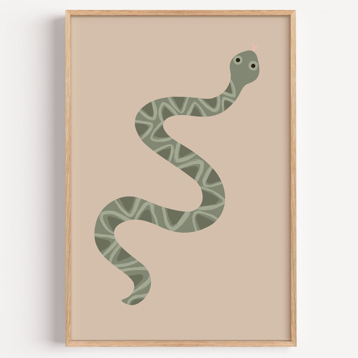 Sage green snake nursery print in a light oak frame on a plain white wall