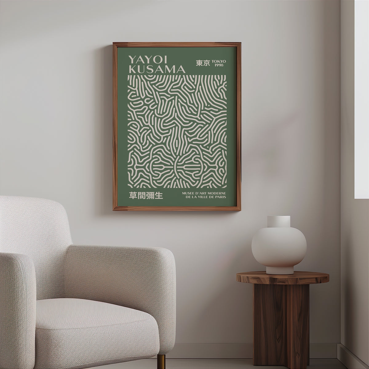 Yayoi Kusama inspired sage squiggle on deep green print above a cream boucle armchair
