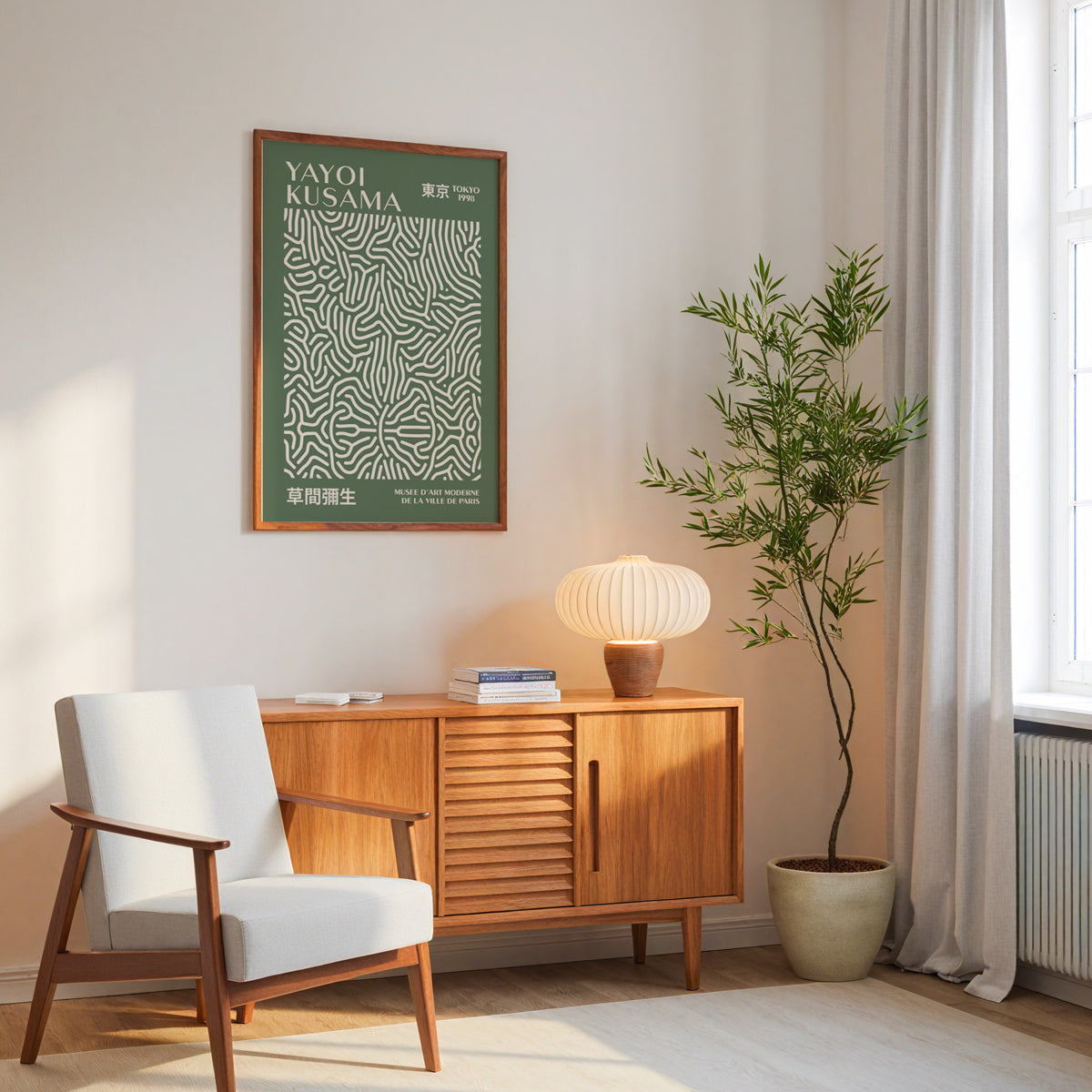 Yayoi Kusama inspired sage squiggle on deep green print above a mid-century sideboard