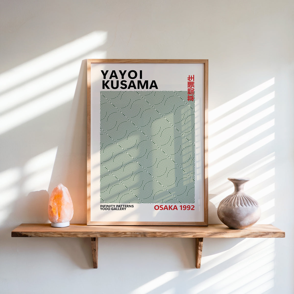 Yayoi Kusama inspired sage green swirl line print above a shelf with a salt lamp