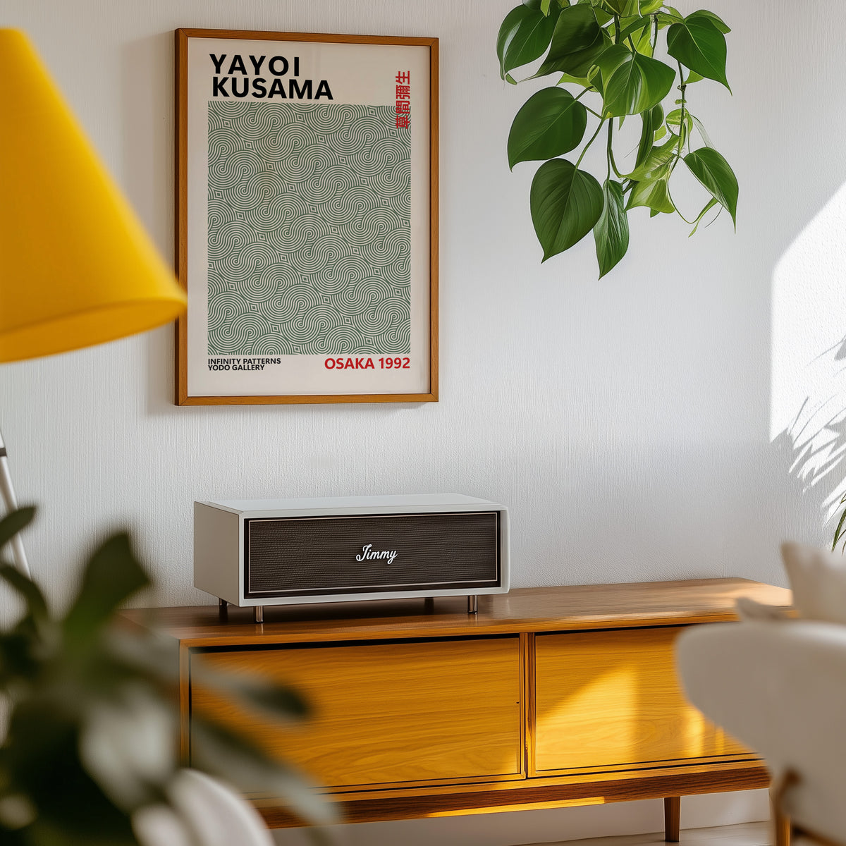 Yayoi Kusama inspired sage green swirl line print above a sideboard with a plant