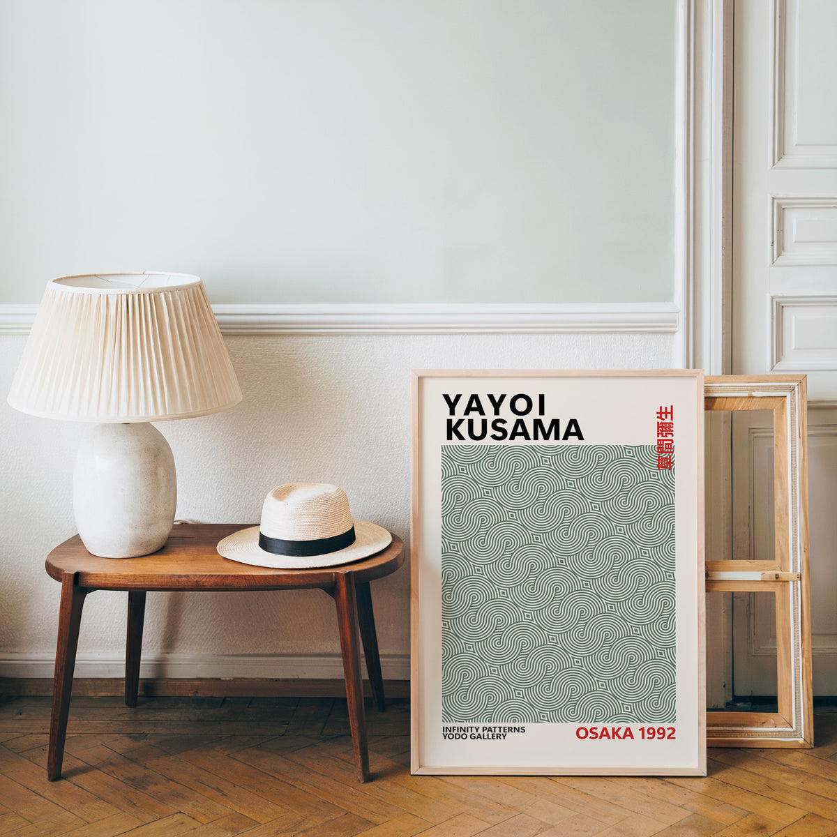 Yayoi Kusama inspired sage green swirl line print beside a bench and straw hat