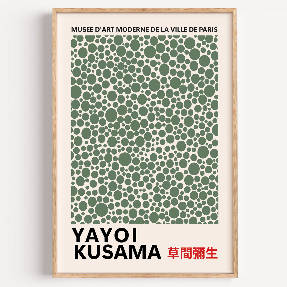 Yayoi Kusama inspired sage green polka dot print in a wood frame on a plain wall