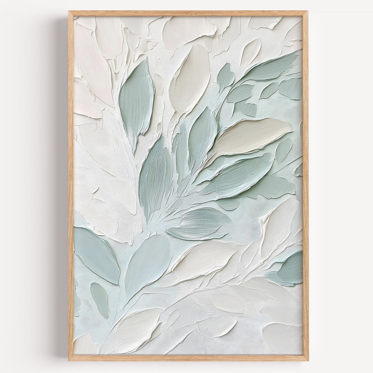 Sage and white impasto leaves botanical print in a light oak frame on a plain white wall