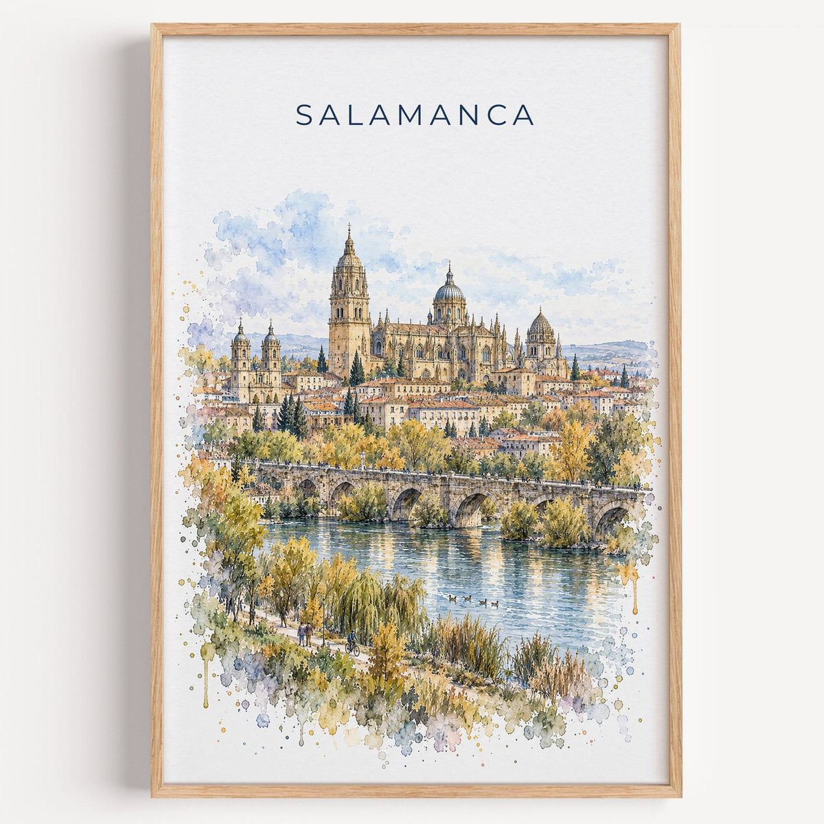 Salamanca watercolor print in a light oak frame on a plain white wall