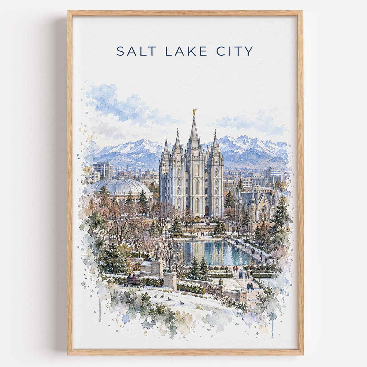 Salt Lake Temple watercolor print in a light oak frame on a plain white wall