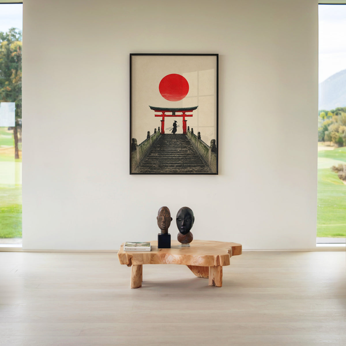 samurai under red torii gate print in a black frame above a live-edge wood coffee table between garden windows