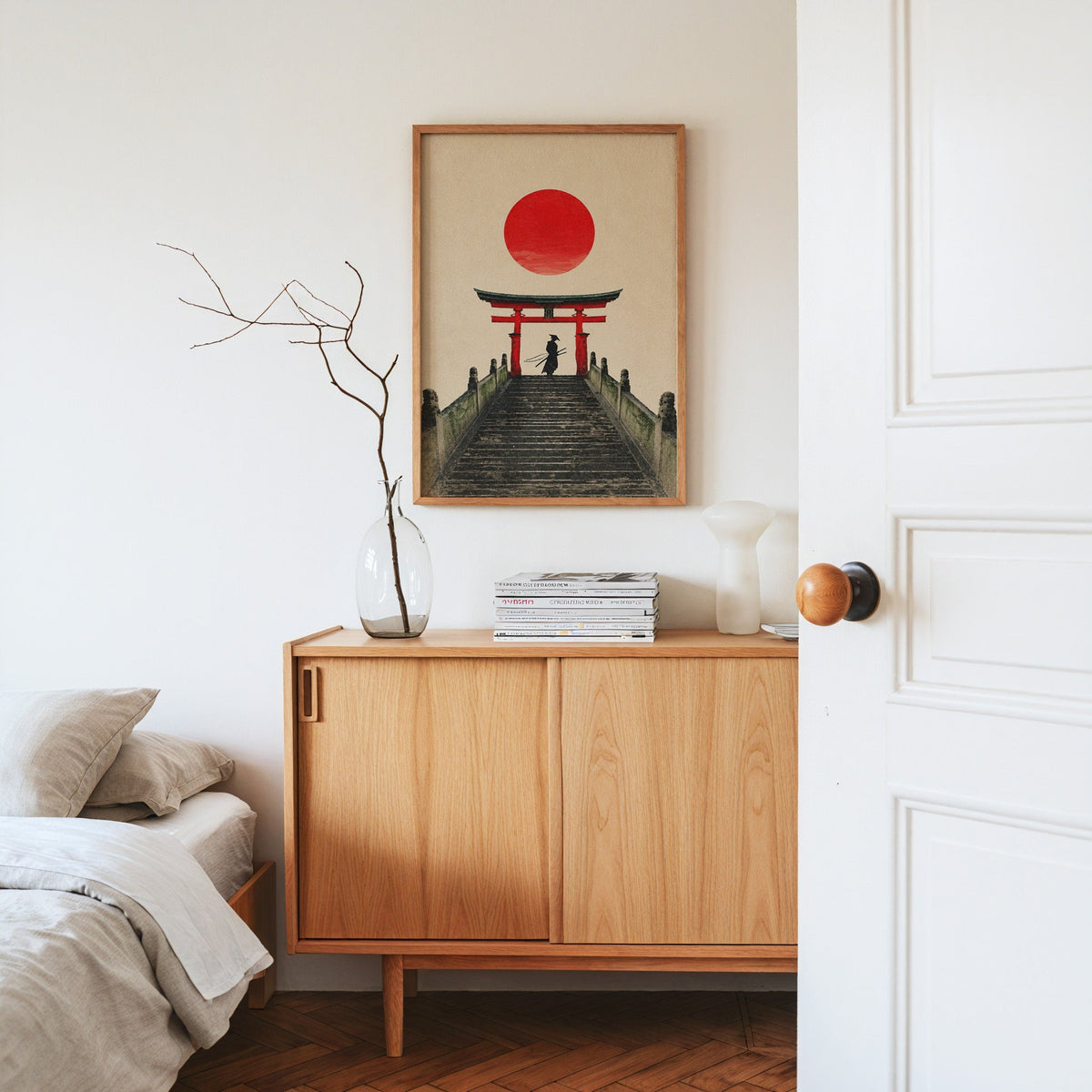samurai under red torii gate print in an oak frame above an oak sideboard in a bedroom with linen bedding