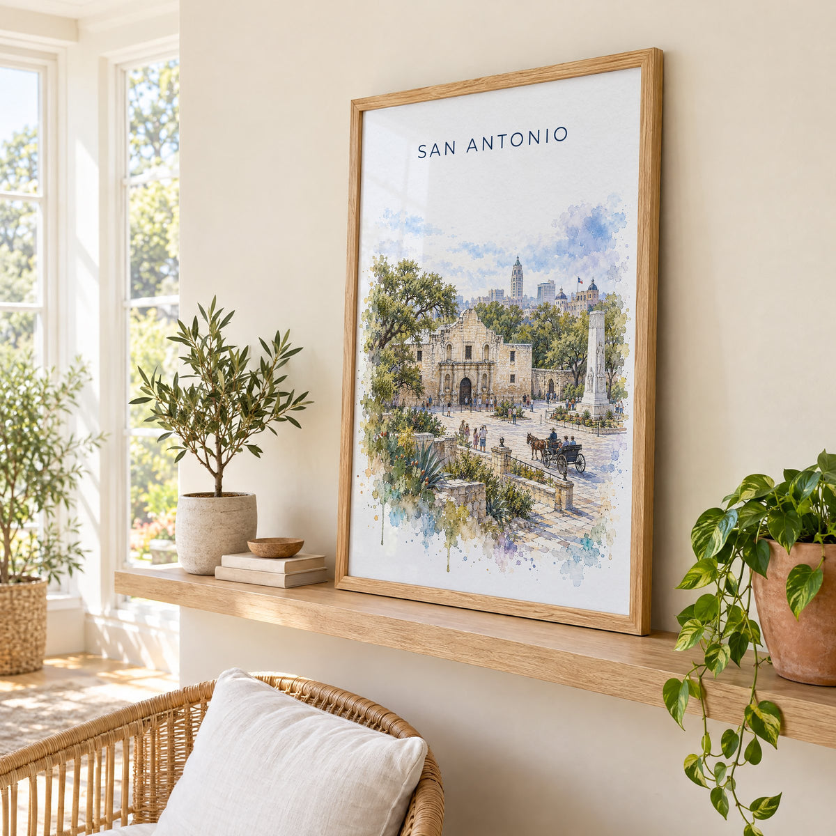 San Antonio watercolor print in an oak frame on a picture ledge in a sunlit sunroom