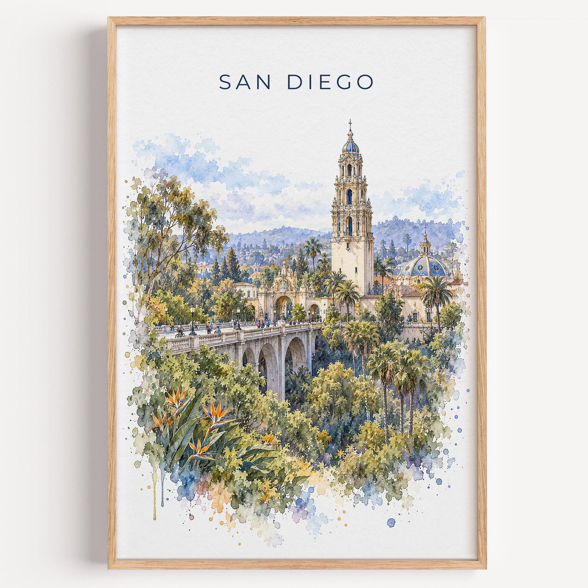 San Diego watercolor print in a light oak frame on a plain white wall