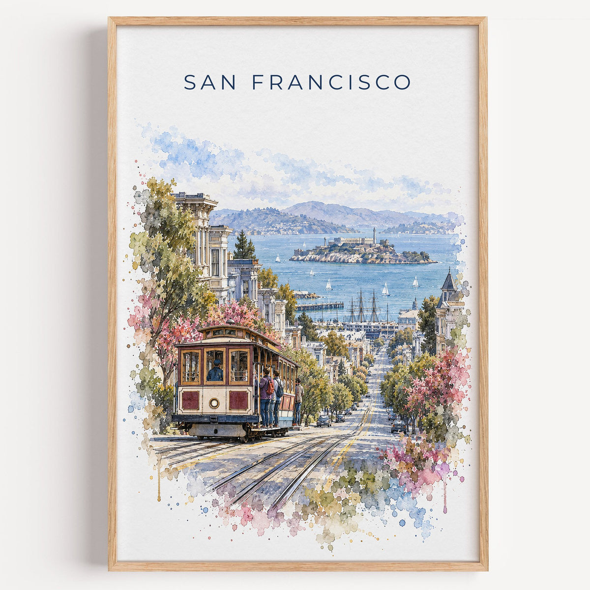 San Francisco Cable Car watercolor print in a light oak frame on a plain white wall