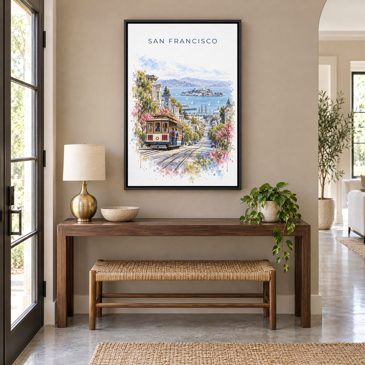 San Francisco Cable Car watercolor print as a black floater canvas above a walnut console and woven bench in an entryway