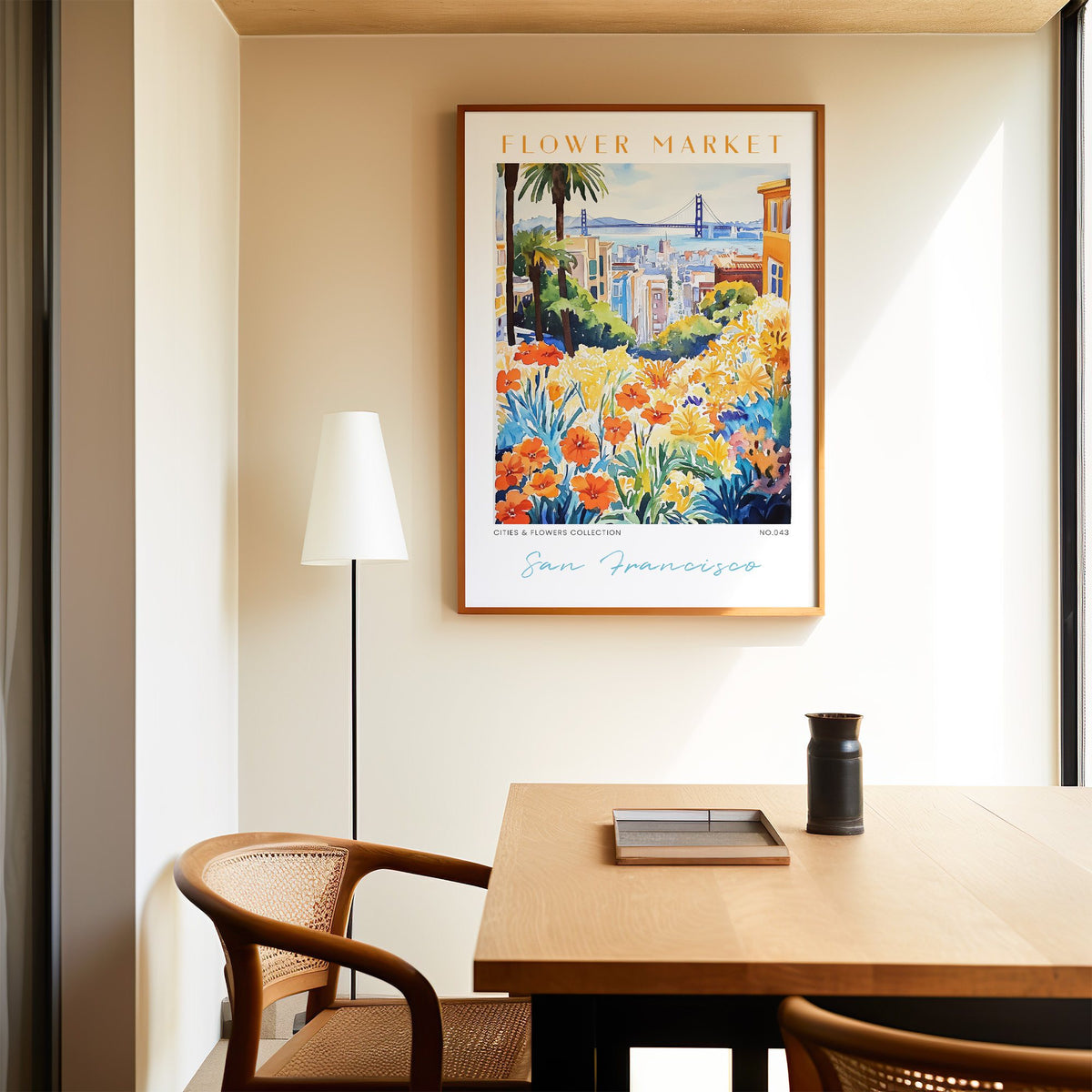 San Francisco flower market print in an oak frame above a dining table and cane chair