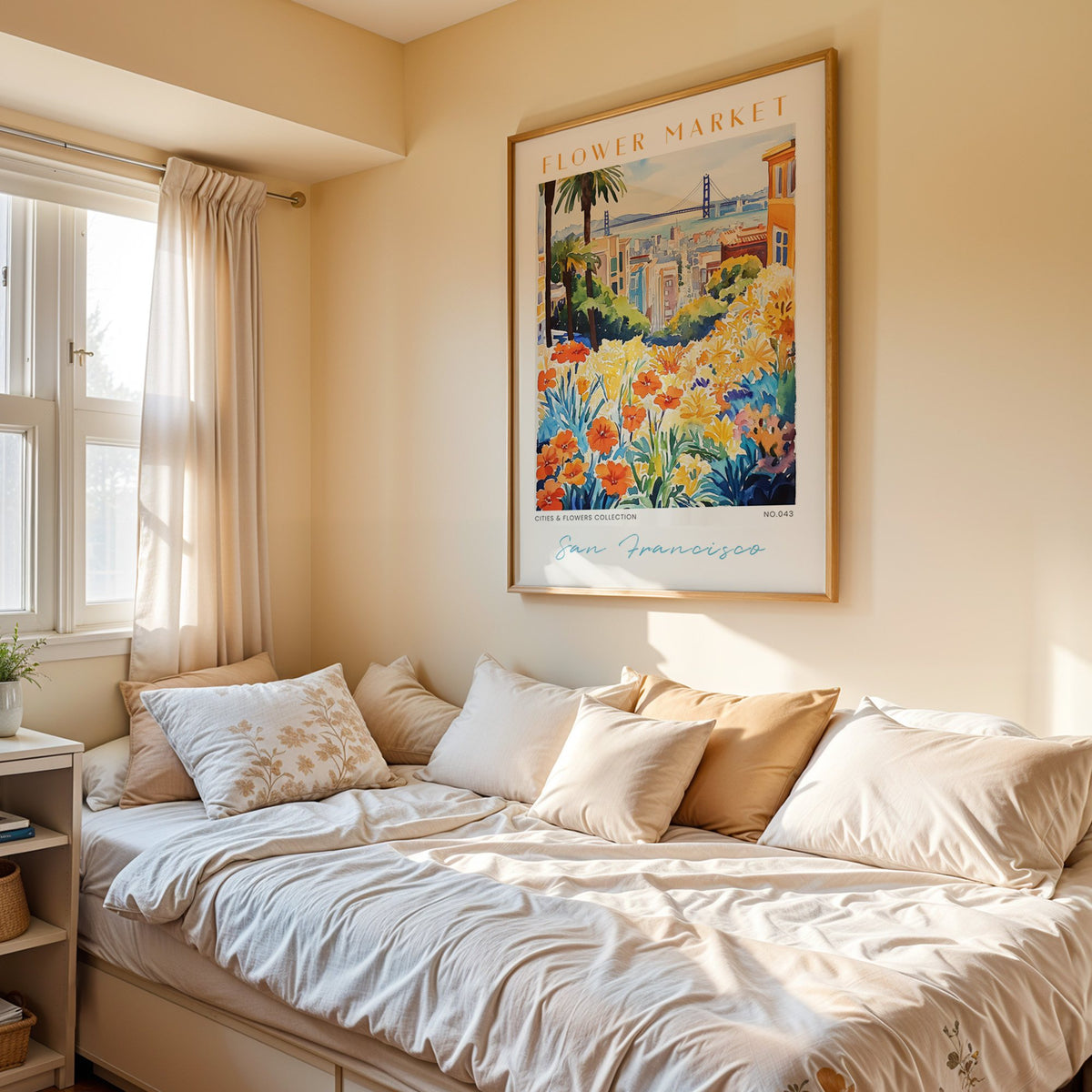 San Francisco flower market print in an oak frame above a cream daybed in a sunny bedroom