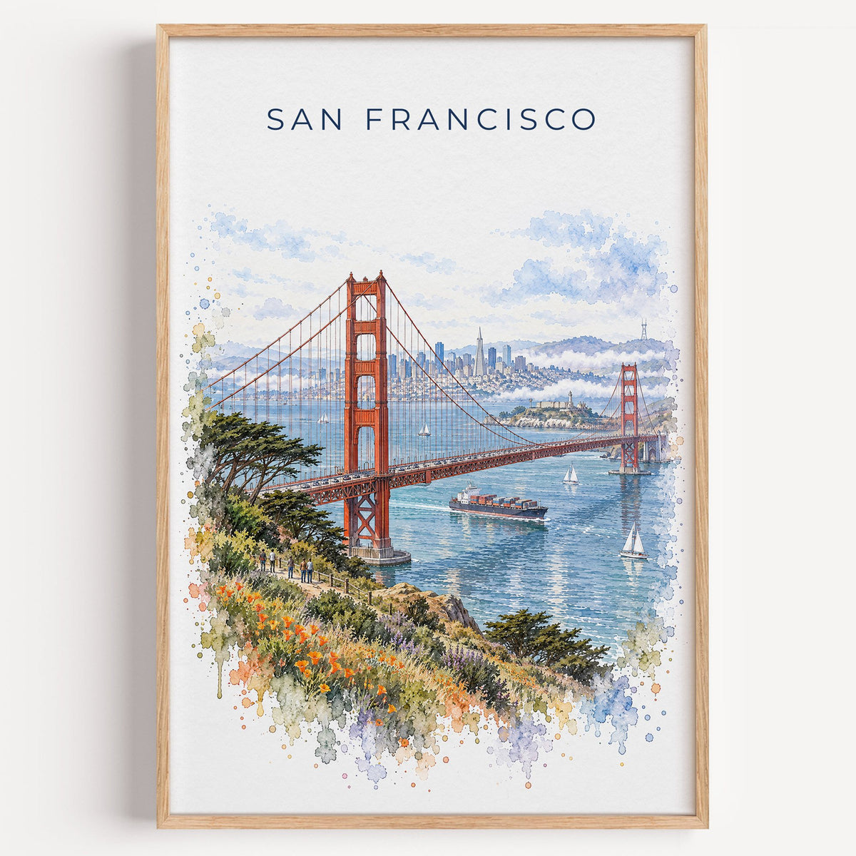 San Francisco watercolor print in a light oak frame on a plain white wall