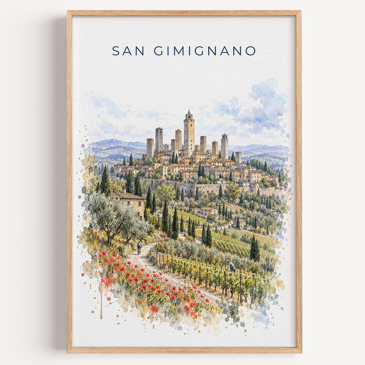 San Gimignano watercolor print in a light oak frame on a plain white wall