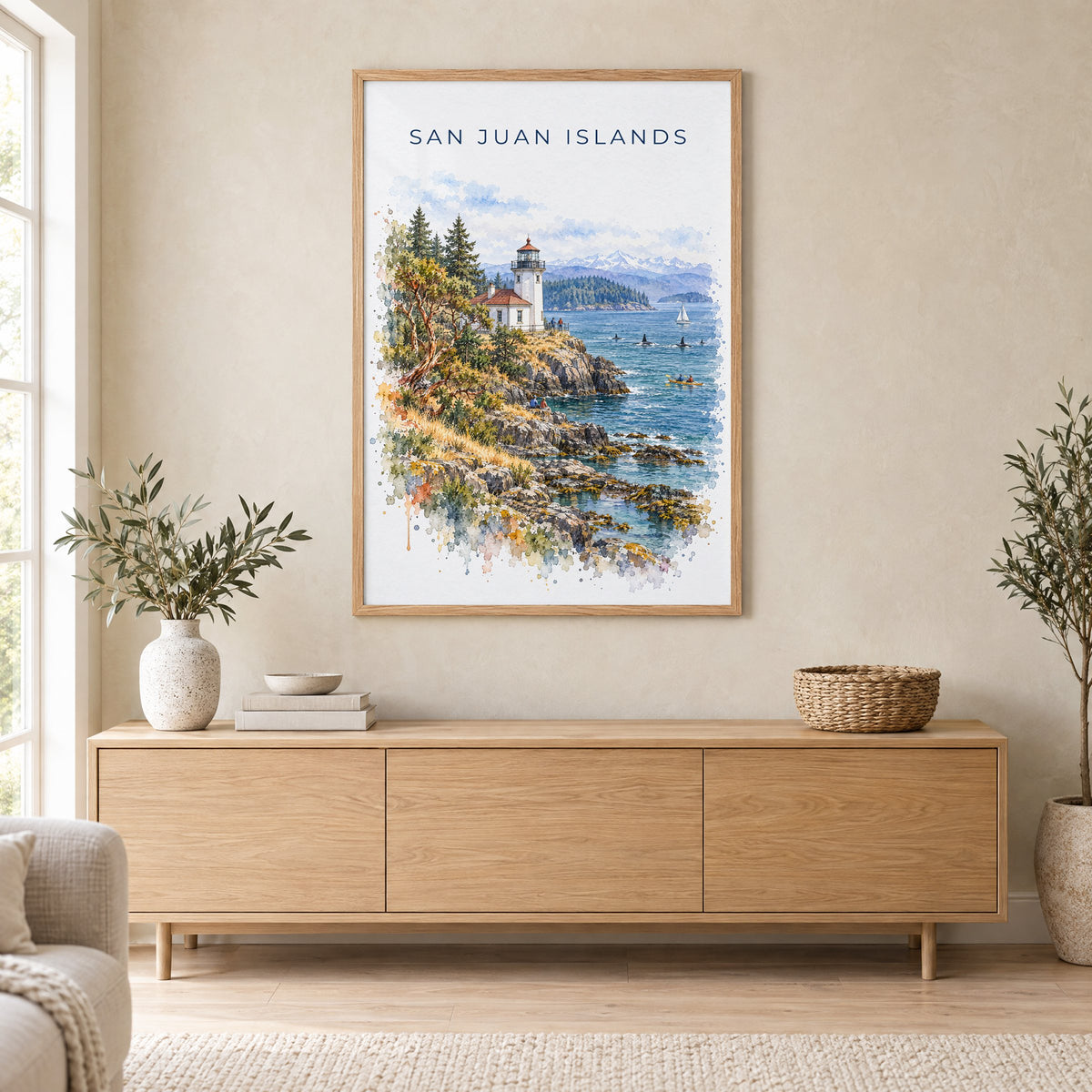 San Juan Islands watercolor print in an oak frame above a light wood sideboard in a Scandinavian living room
