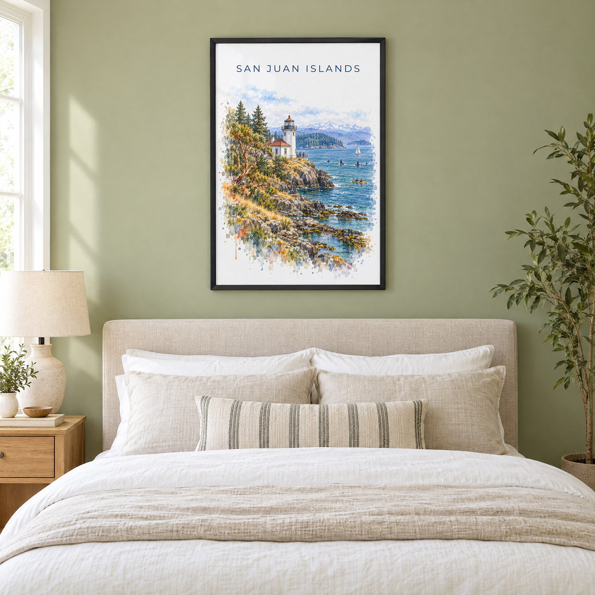 San Juan Islands watercolor print in a black frame above an upholstered headboard in a sage green bedroom